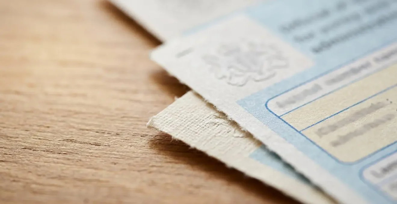 Close-up detail of official healthcare financial support documentation and claim forms