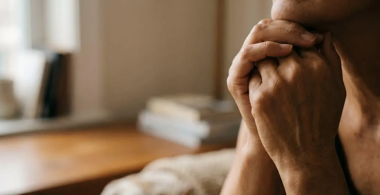 Close human-centered view of hands managing post-operative medication with natural emotion