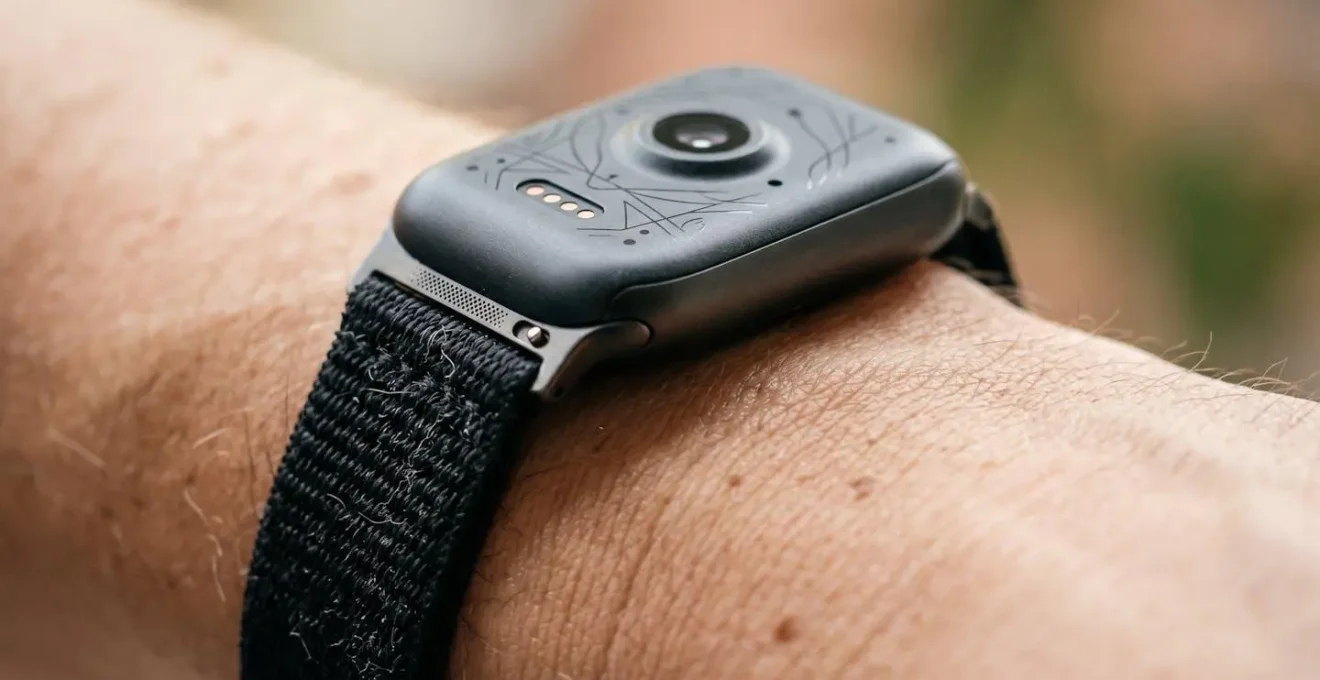 Close-up of a medical-grade wearable device on a wrist showing advanced health monitoring sensors in natural lighting