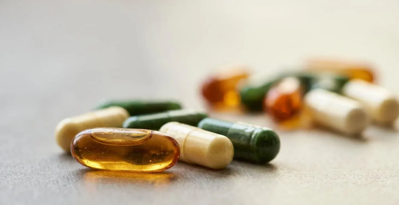 Close-up macro photograph of supplement capsules showcasing detailed textures